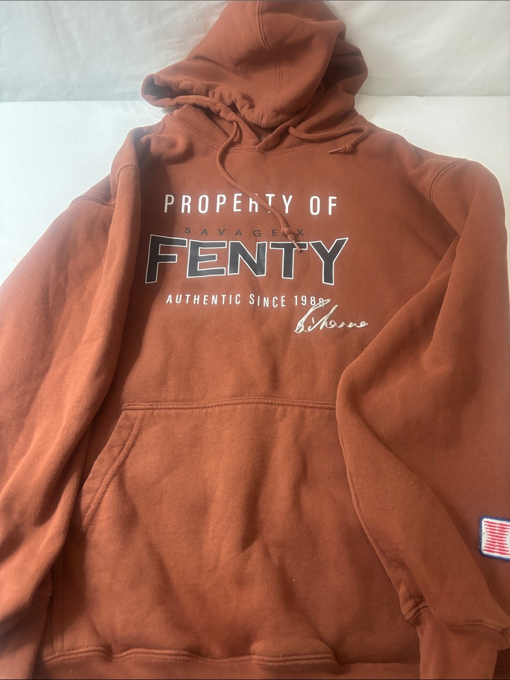 Savage X Fenty  Hoodie in Rust Orange with Black & White Logo